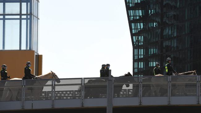 Police on horseback patrol Melbourne’s CBD on Tuesday. Picture: AFP