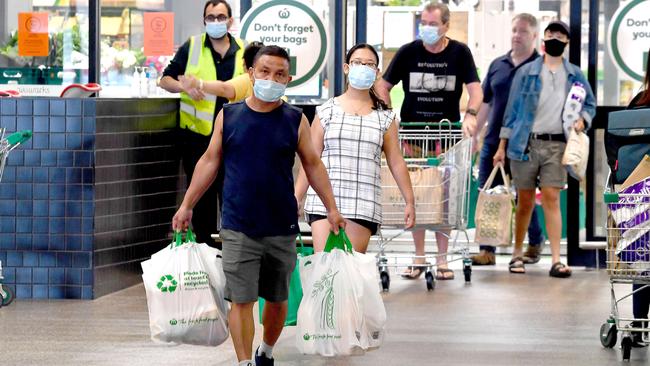 Shoppers at Woolworths at Gasworks Plaza in Newstead before the 6pm start of the three-day lockdown for Greater Brisbane. Picture: John Gass