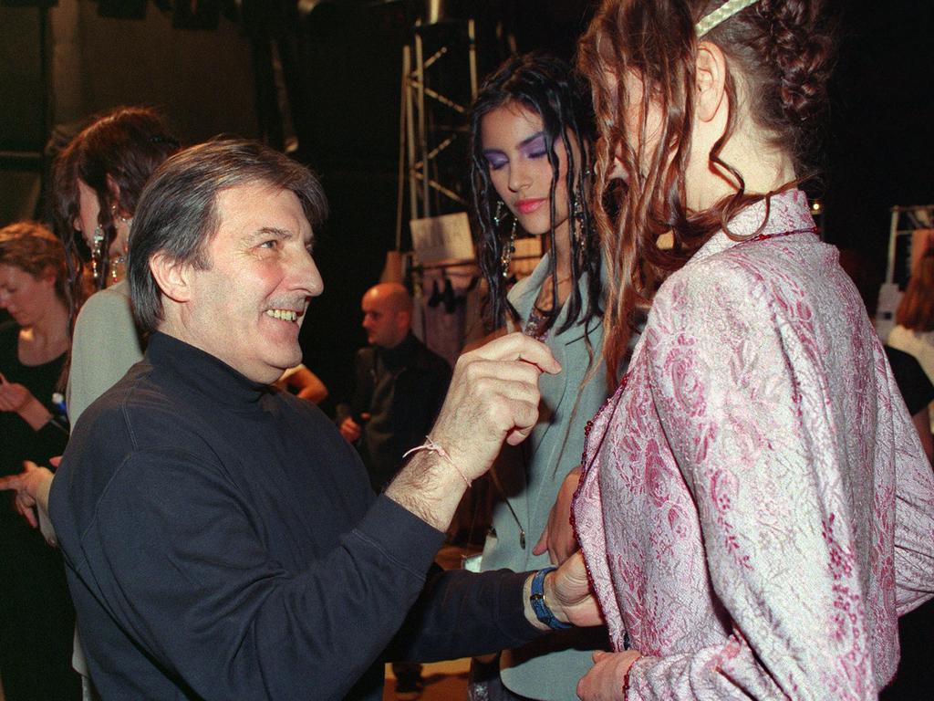 French designer Emanuel Ungaro checks a dress on a model before his 1999 spring/summer Haute Couture collection in Paris. Picture: AFP