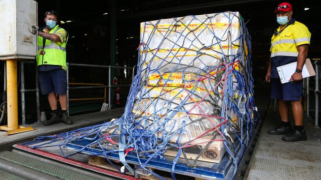 The first doses of the Pfizer/BioNTech vaccine are offloaded at Sydney Airport on Monday. Picture: Gaye Gerard