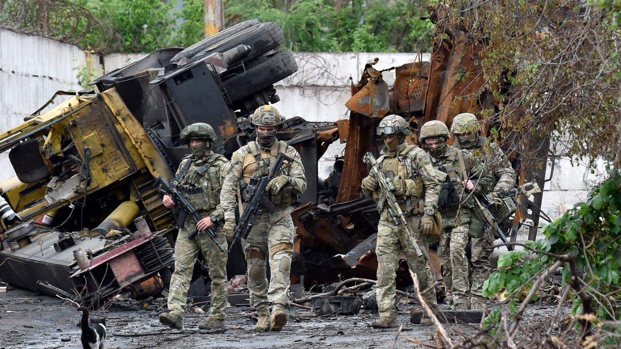 Russian servicemen patrol the destroyed part of the Ilyich Iron and Steel Works in Ukraine's port city of Mariupol. Picture: Olga Maltseva / AFP.