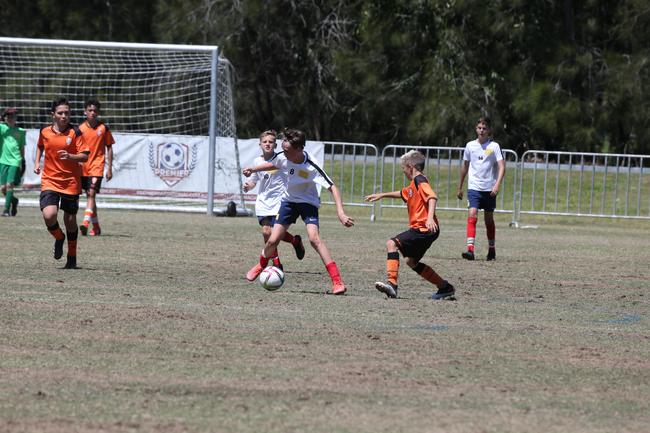 The Premier Invitational football tournament on the Gold Coast. Brisbane Roar Orange v TFC Brisbane White under-13s in action. Picture: Mike Batterham.