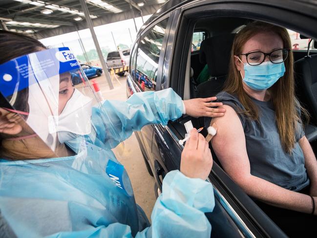 A nurse administers the Pfizer COVID-19 vaccine at a drive through vaccination centre in Melton. Picture: Getty Images