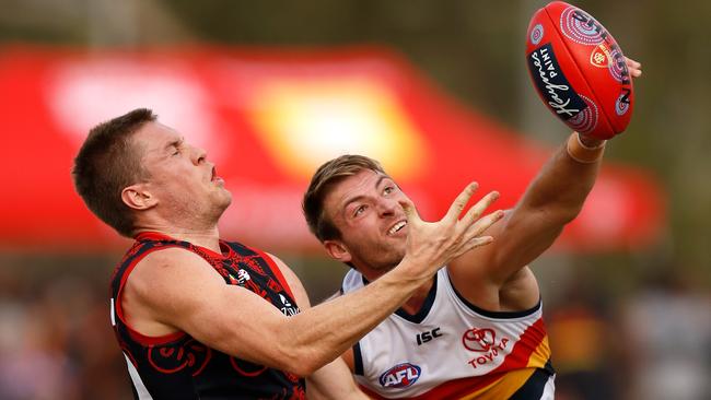 Crows defender Daniel Talia spoils Melbourne’s Tom McDonald. Picture: Michael Willson/AFL Media/Getty Images