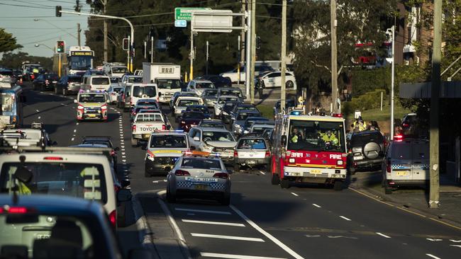 Police tend to a roadside accident. Picture: Dylan Robinson