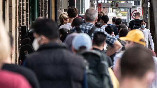 People queue for access to a Centrelink centre in Sydney. Picture: AAP