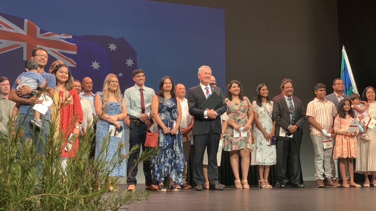 Mackay Mayor Greg Williamson stands with new Australians at the MECC on Australia Day. Mr Williamson read out the affirmation and oath and the new citizens repeated the words, confirming their new citizenship. Wednesday, January 26, 2022. Mackay Australia Day 2022. Mackay Citizenship Ceremony 2022. Picture: Duncan Evans