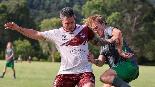 Troy Hearfield (left) in action for Boambee in the Coastal Premier League.