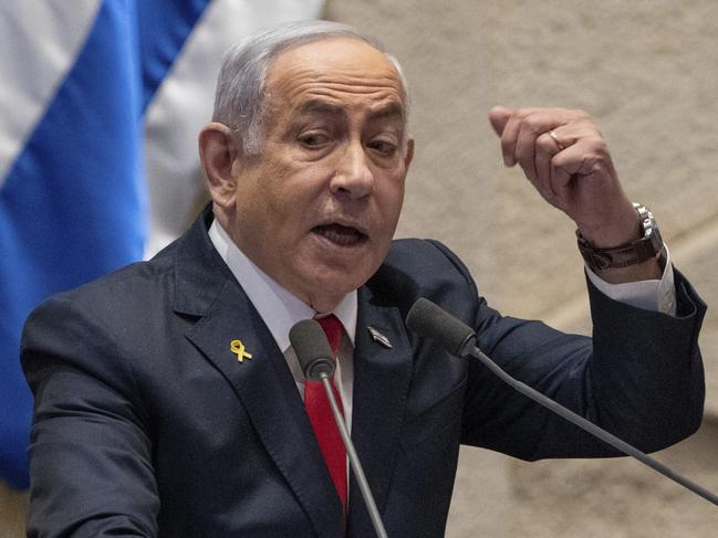 FILE - Israel's Prime Minister Benjamin Netanyahu addresses lawmakers in the Knesset, Israel's parliament, in Jerusalem. Monday Nov. 18, 2024. (AP Photo/Ohad Zwigenberg, File)