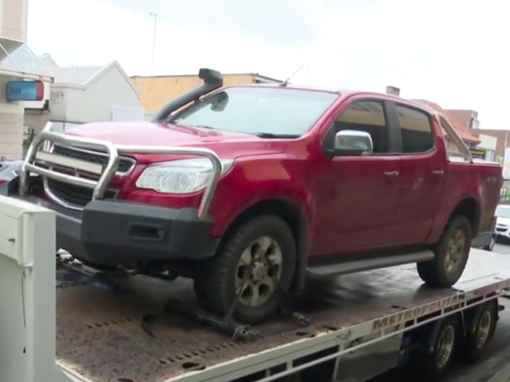 Police tow away a red ute for forensic testing. Picture: Nine News