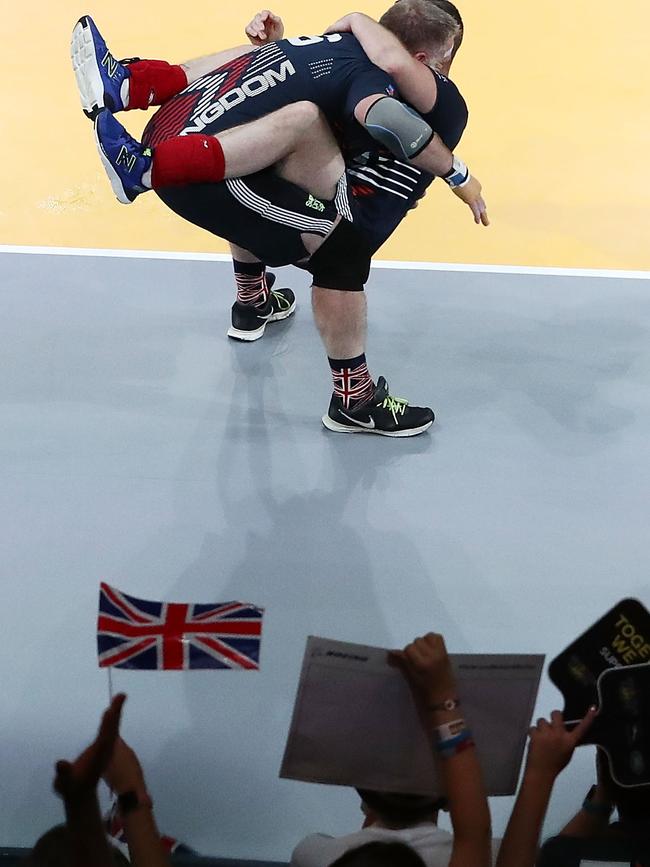 The UK team celebrate winning match point in the sitting volleyball match between the UK and Jordan. Picture: Mark Metcalfe/Getty Images for The Invictus Games Foundation