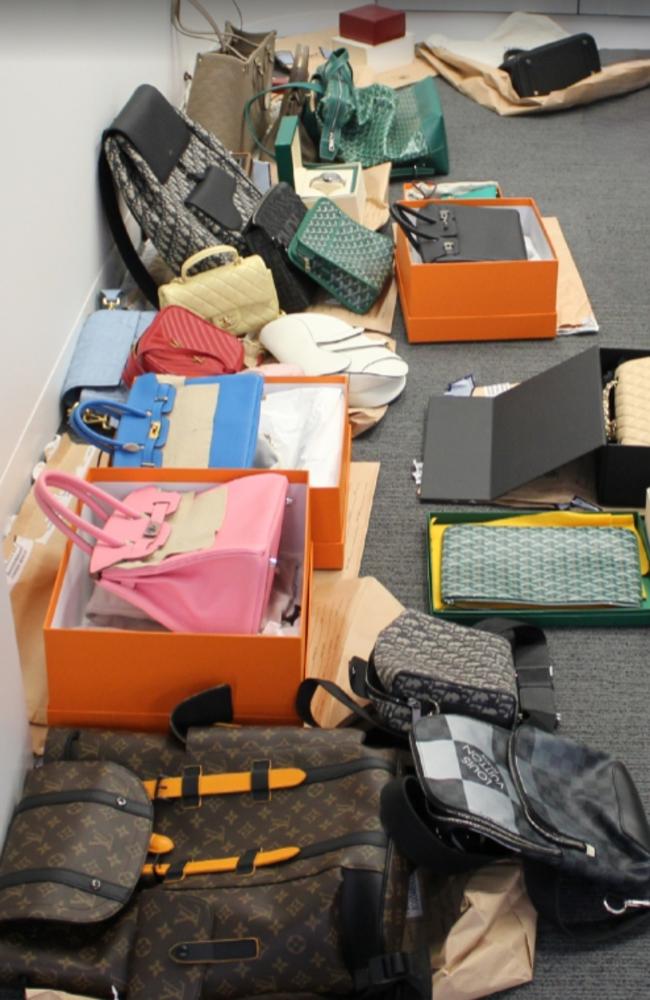 Luxury handbags seized by police.