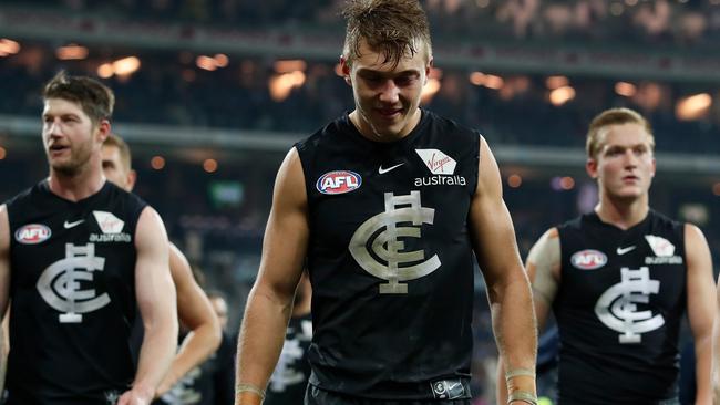 Carlton players trudge off the field after another loss. Picture: AFL Media/Getty