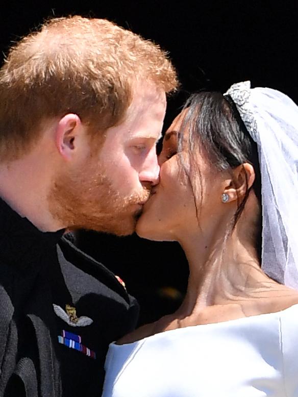 Harry and Meghan shared a kiss in front of crowds at their 2018 wedding in Windsor. Picture: Ben STANSALL / POOL / AFP