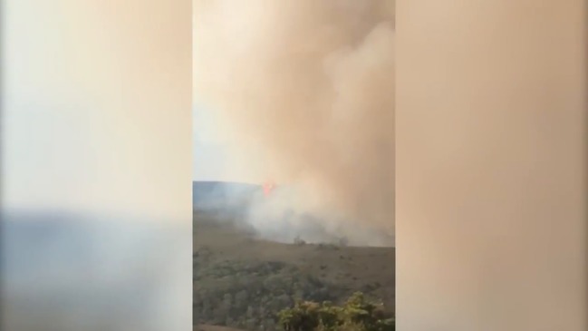 Fire retardant is dropped by a plane during the Gell River fire in Tasmania