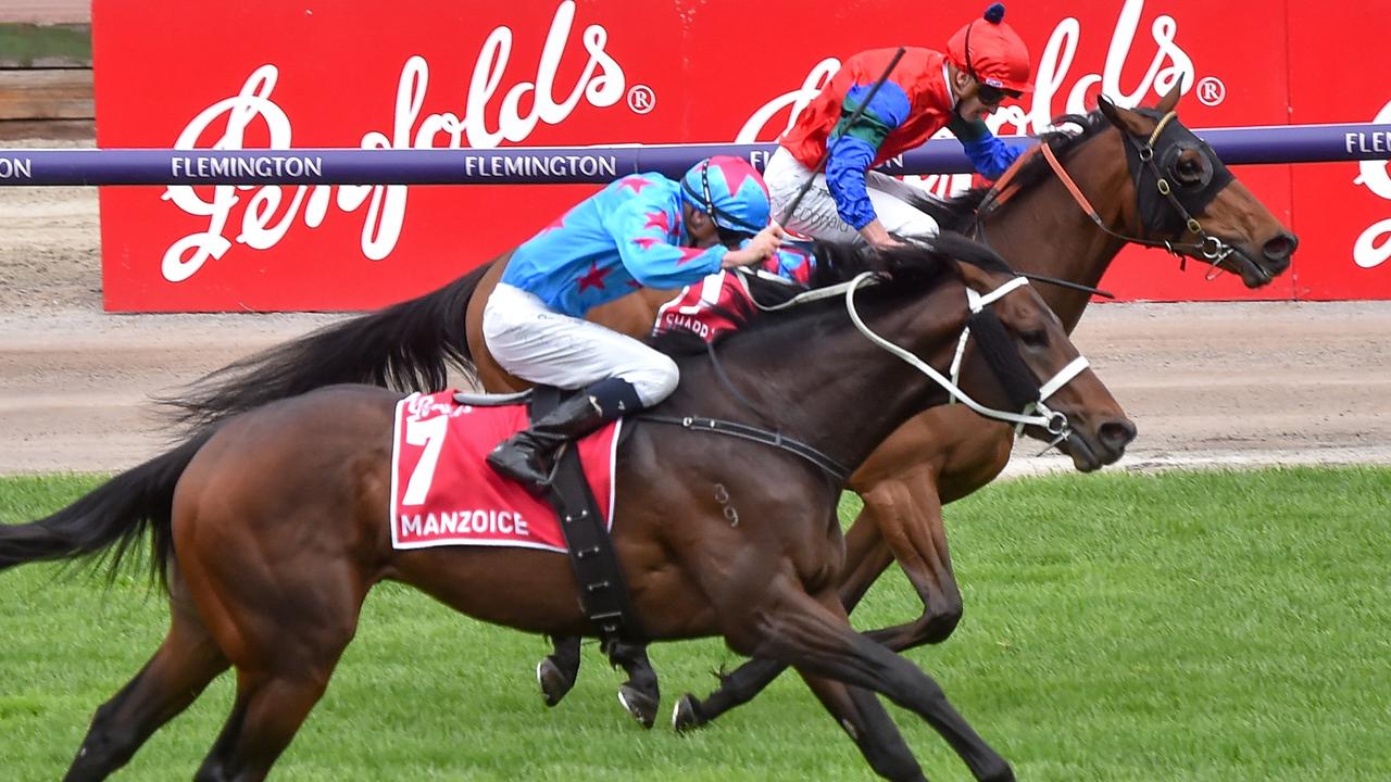 Manzoice and Michael Dee (outside) deny favourite Sharp ‘N’ Smart in the Victoria Derby at Flemington. Picture: Reg Ryan-Racing Photos via Getty Images