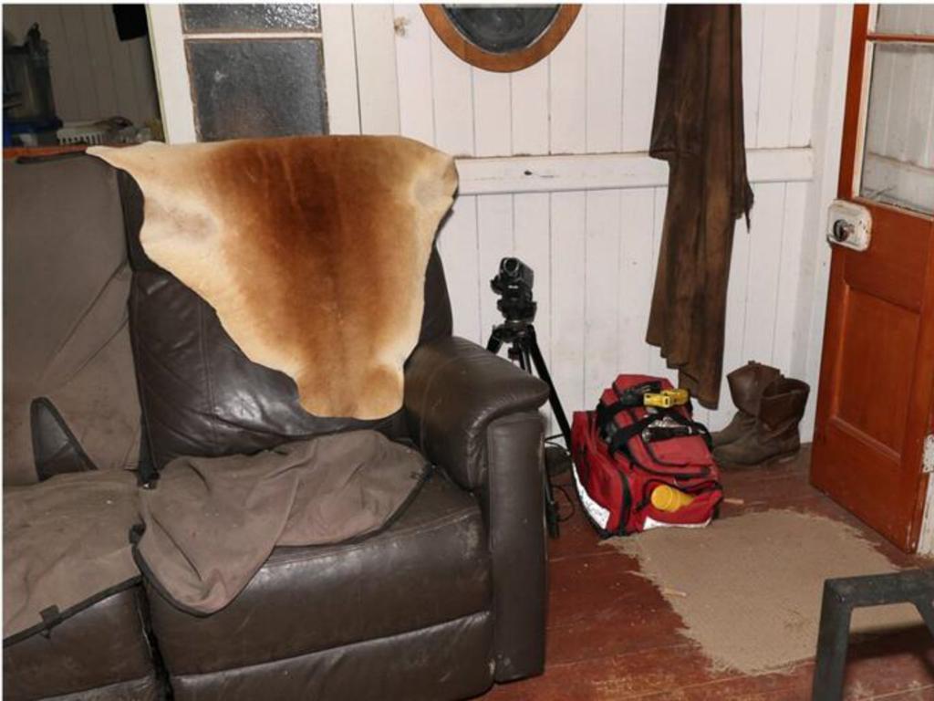 A tripod, and what appears to be a first aid bag, located in the Train house.