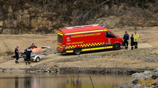 Fire and Rescue NSW HAZMAT unit arriving at the scene at Ben Boyd Reservoir where a water-bombing helicopter crashed. Picture: Jonathan Ng