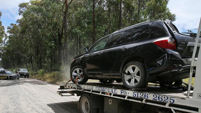 An allegedly stolen car is taken from the scene. Picture: Ian Currie