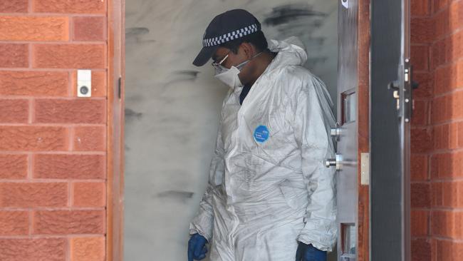 A police forensics officer works at the scene of the alleged bashing. Picture: David Swift