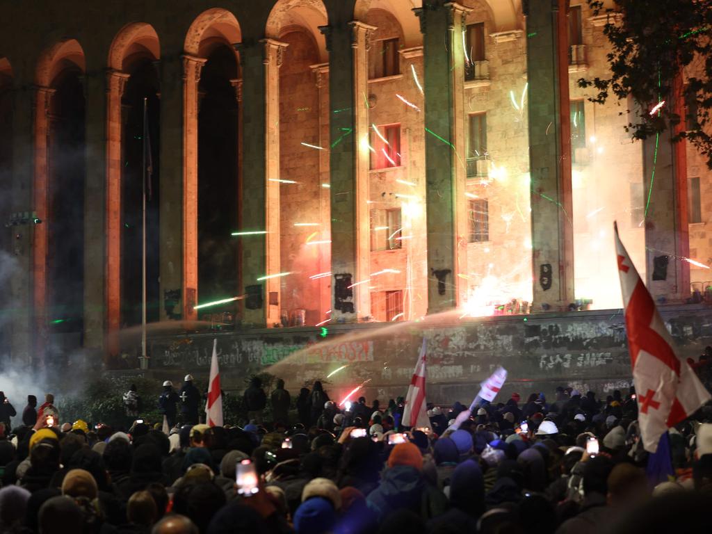 Fireworks were seen exploding on the steps of the Parliament building in Tbilisi. Picture: Giorgi ARJEVANIDZE / AFP