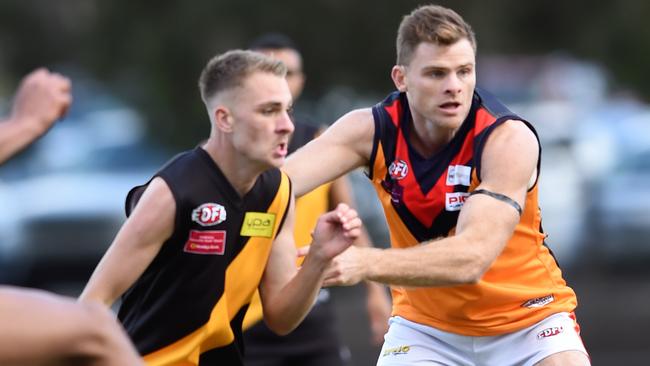 East Keilor’s Heath Shaw locks horns with a Westmeadows opponent. Picture: Steve Tanner