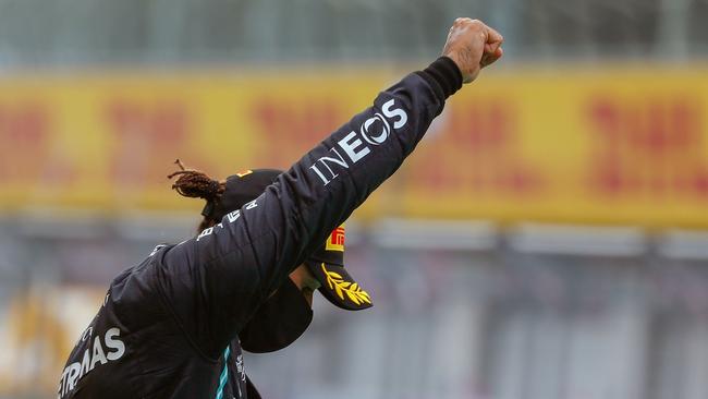 Formula One driver Lewis Hamilton raises a fist during a Black Lives Matter protest. Picture: AFP