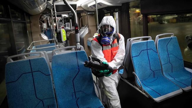 A cleaning company employee disinfects a bus in Paris. Picture: AFP