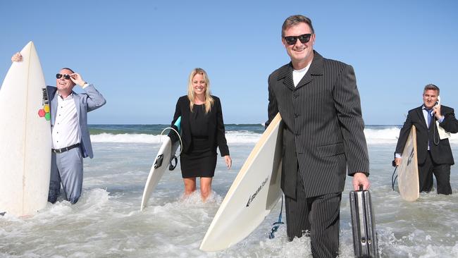 The surfing corporate types. Lifestylepanel CEO Ben Westaway, Wyndham’s Natalie McCarthy and CEO Barry Robinson, and Bespoke Interior Solutions Managing Director Jeff Pilkington. Picture Glenn Hampson.