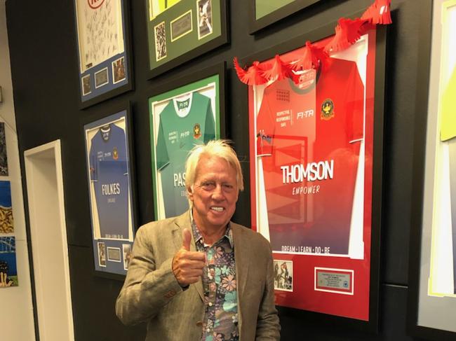 Jeff Thomson gives the thumbs up next to his framed house jersey at Punchbowl Boys High.