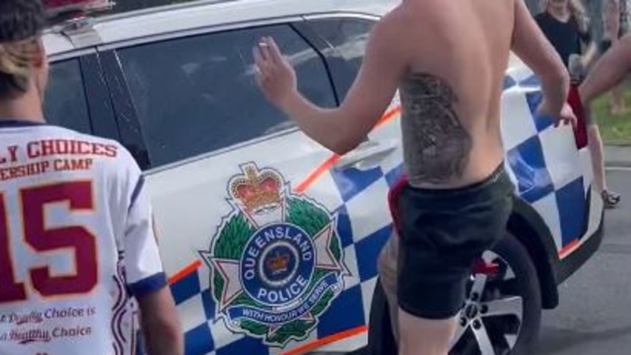 Crowds ambush a police car at Logan. Picture: JaydenMoss/Instagram