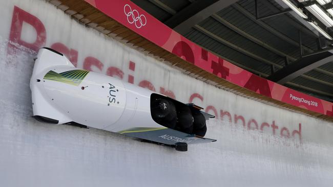 Driver Lucas Mata, David Mari, Lachlan Reidy and Hayden Smith of Australia during training run for the four-man bobsleigh. Photo: AP