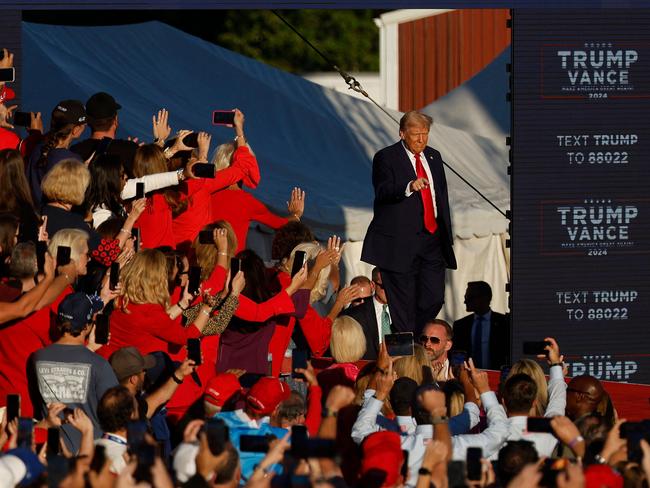 Donald Trump takes to the stage at the Butler Farm Show fairgrounds. Picture: Getty Images via AFP