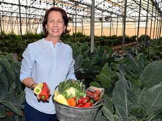 FOOD BOWL: Kate Rehbein with some of the produce she grew in the lead-up to Bundy Flavours. Picture: Mike Knott BUN030719REH10