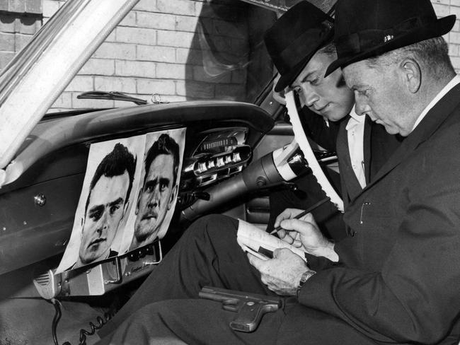 1965: Enlarged pictures of Pentridge escapees Peter Walker and Ronald Ryan placed in police cars for quick identification.