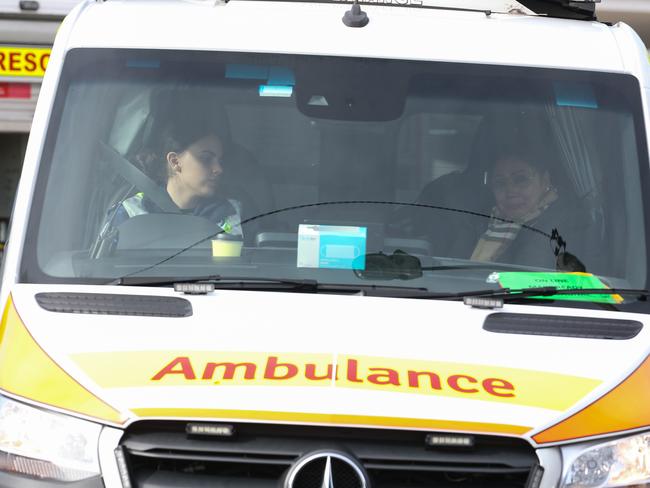 SYDNEY, AUSTRALIA - NewsWire Photos - MAY 21, 2024: The mother seen in the front seat of an Ambulance after her son was involved in a truck crash in Bexley early this morning, with Emergency crews, including firefighters, on the scene who worked hard to remove the driver who was trapped in the vehicle under rubble as the roof came down. The driver now in a stable condition is seen being taken to hospital. Picture: NewsWire / Gaye Gerard