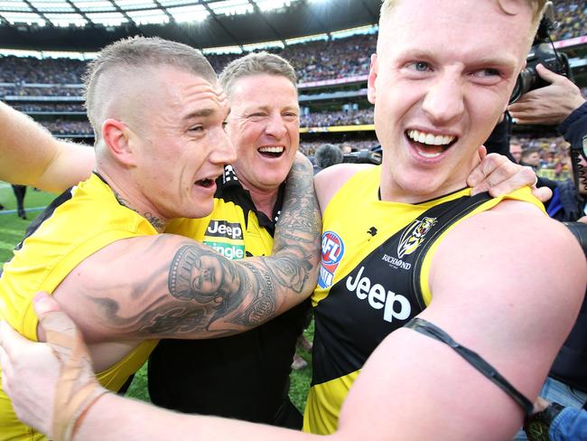 Richmond coach Damien Hardwick with Dustin Martin and Josh Caddy . Pic: Michael Klein