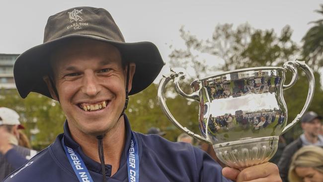 Evan Gulbis holds one of his several Carlton premierships aloft. Picture: Valeriu Campan