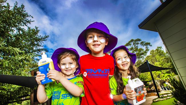 Four-year-olds Aurora Alderton, Fletcher Egan and Lucinda Bourke love being sun smart. Picture: Nigel Hallett