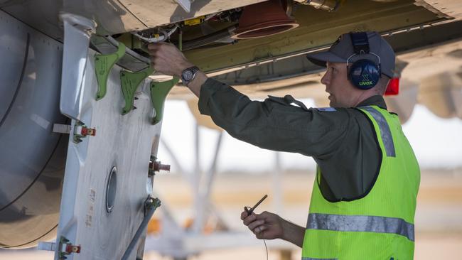 RAAF No. 11 Squadron pilot, Flight Lieutenant Gus Wheeler, conducts pre-flight checks of the P-8A Poseidon spy aircraft before a mission on Operation Resolute, protecting our northern approaches Picture: Defence