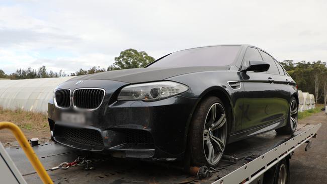 A Volkswagen Golf, BMW and Lexus where found at the home in Austral. Picture NSW Police.