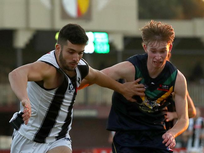 MELBOURNE, AUSTRALIA - MAY 21: Billy Drake of Collingwood and Max Michalanney of the NAB AFL Academy competes for the ball during the match between the AFL Academy and Collingwood Magpies at Skybus Stadium on May 21, 2022 in Melbourne, Australia. (Photo by Kelly Defina/AFL Photos/Getty Images)