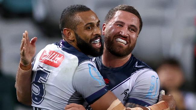 Josh Addo-Carr and Kenny Bromwich embrace during their rampant win over Souths. Picture: Getty Images