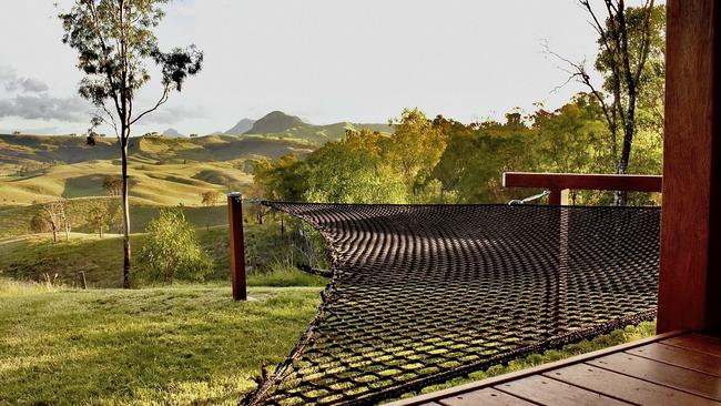 Soak in the view from the infinity hammock at Baya Tiny House Eco Retreat