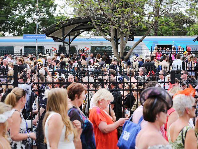 Transport chaos as racegoers attempt to board trains for the city after Melbourne Cup Day 2014 at Flemington Racecourse. Picture: Nathan Dyer