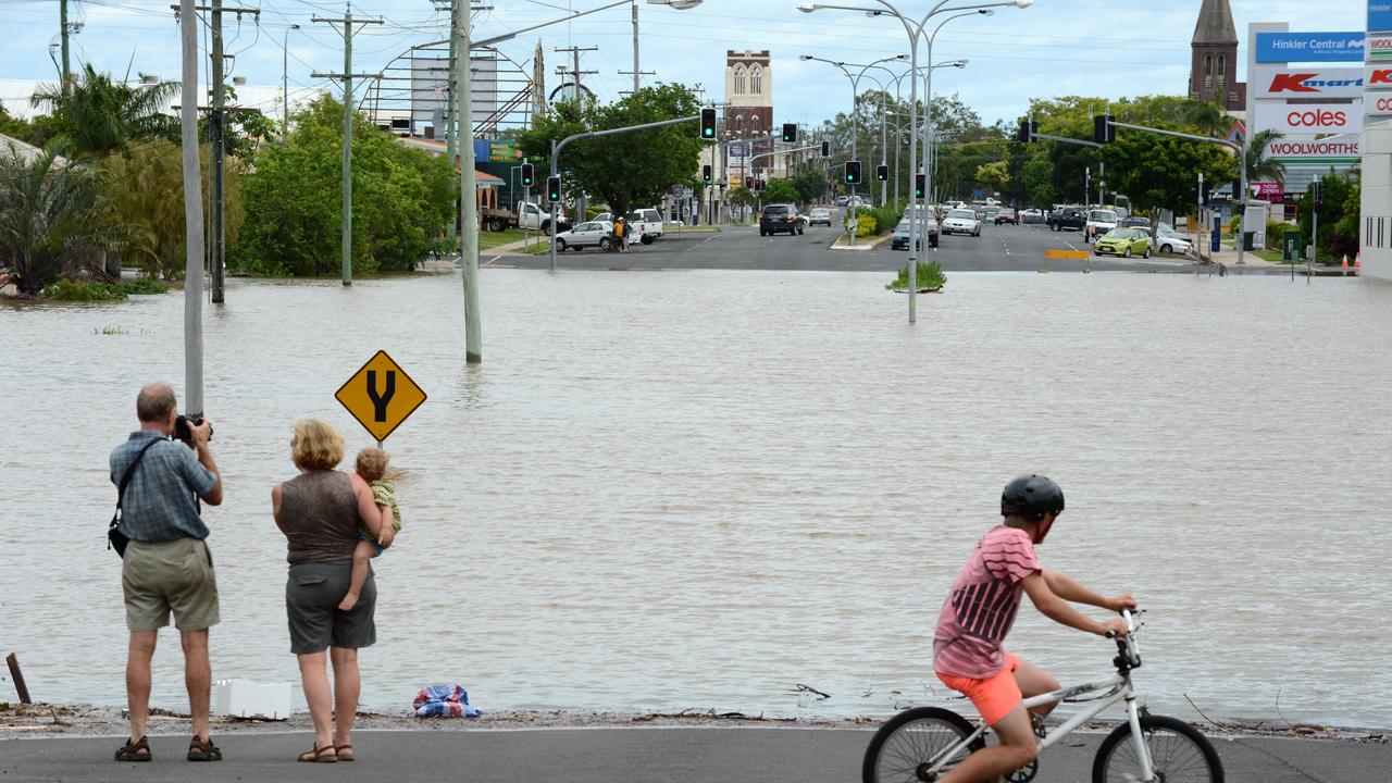 Locals watch as flood water rise in Bundaberg, Queensland, Monday, Jan. 28, 2013. At least 1200 Bundaberg properties are already flooded, and there are fears that could reach 2000. (AAP Image/Dan Peled) NO ARCHIVING