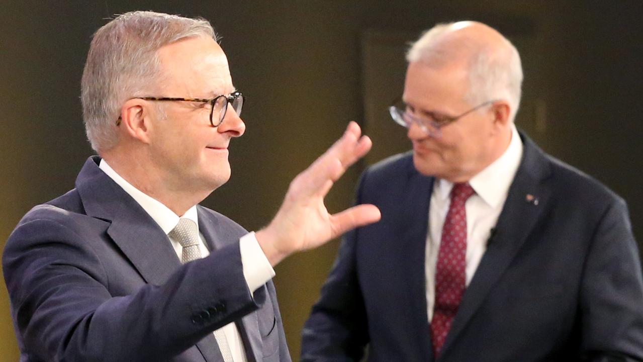 Anthony Albanese and Scott Morrison leave the first 2022 election debate in Brisbane on Wednesday night. Picture: Steve Pohlner