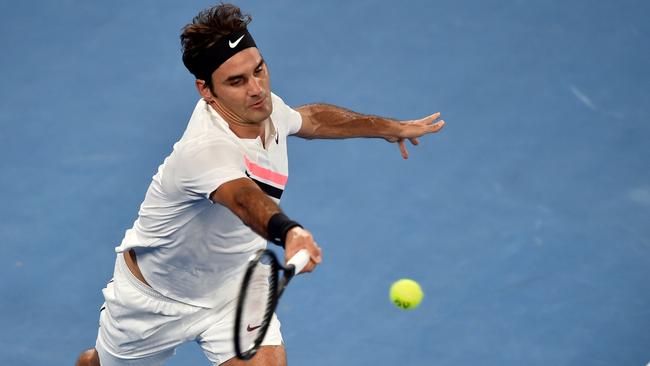 Roger Federer plays a forehand during his Round 2 night match.