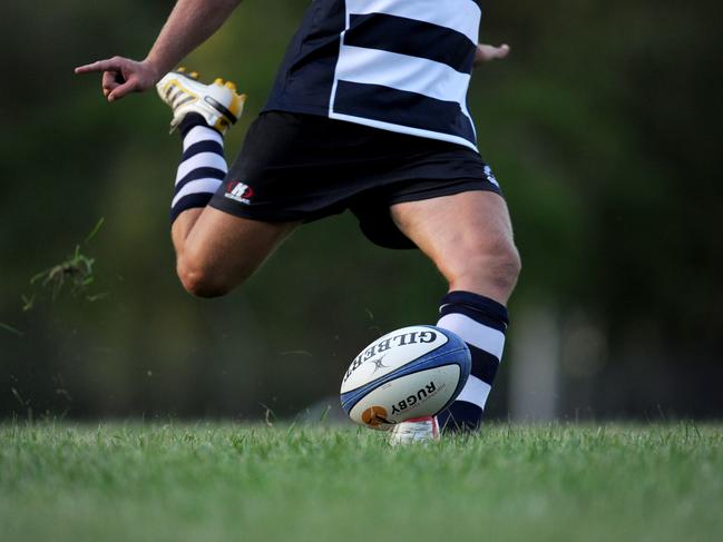 Generic action pictures of Casuarina Cougars. Zac Phillips kicks for goal.