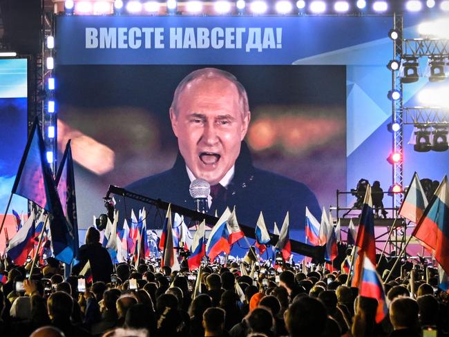 Russian President Vladimir Putin on screen set at Red Square as he addresses a rally and a concert marking the annexation of four regions of Ukraine occupied by Russian troops on September 30, 2022. Picture: AFP